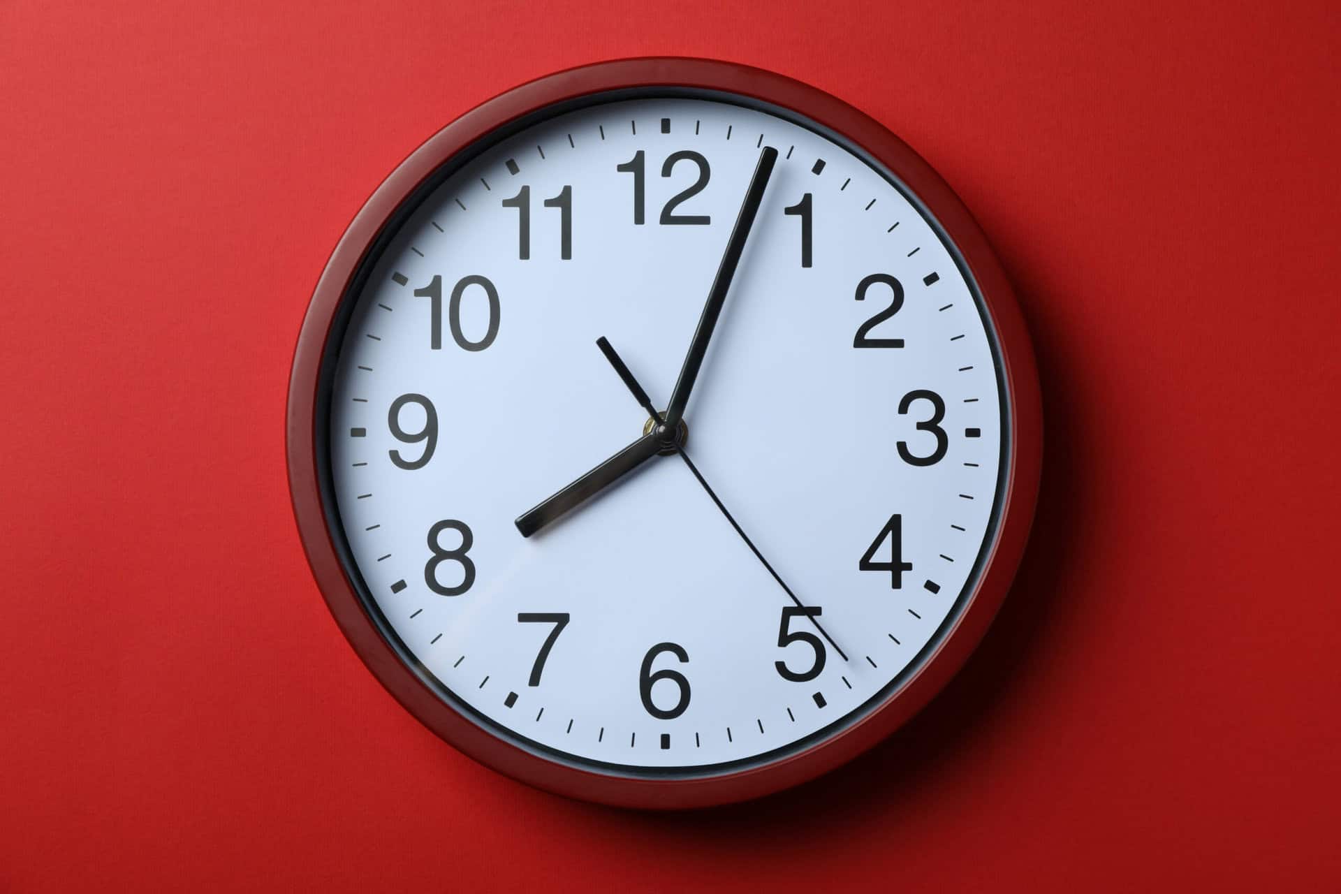 Standard red home clock on red background